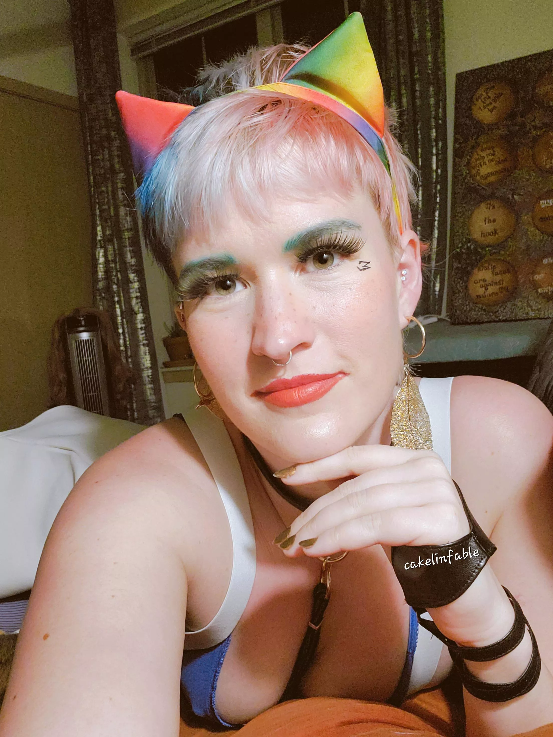 A freckled green eyed rainbow eared cat girl! 🤓