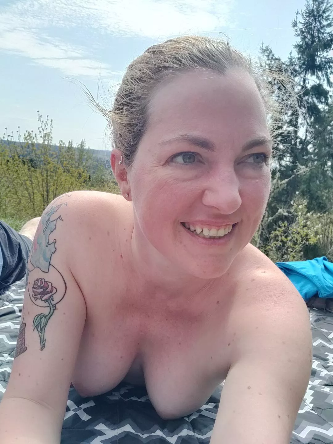 A topless moment in the sun after a hike to a peak