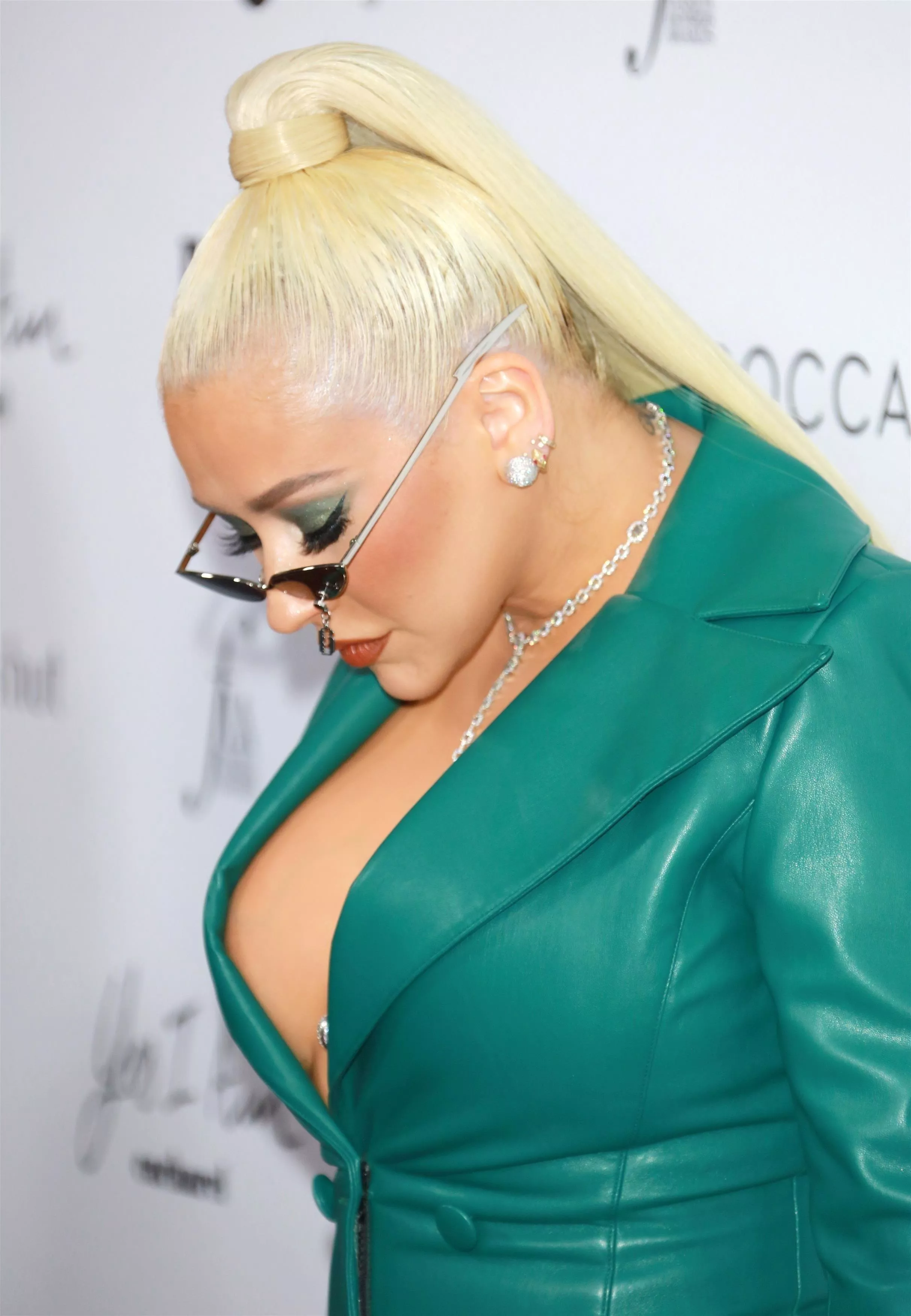 Christina Aguilera is checking her cleavage