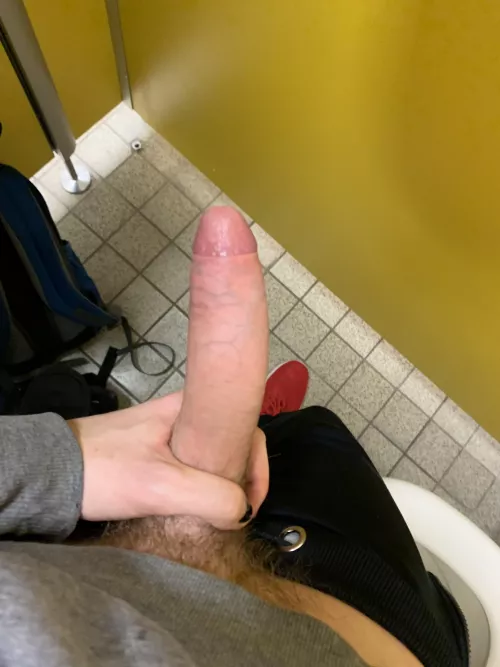 Jerking it, knowing there’s a face only inches away from my cock behind that wall