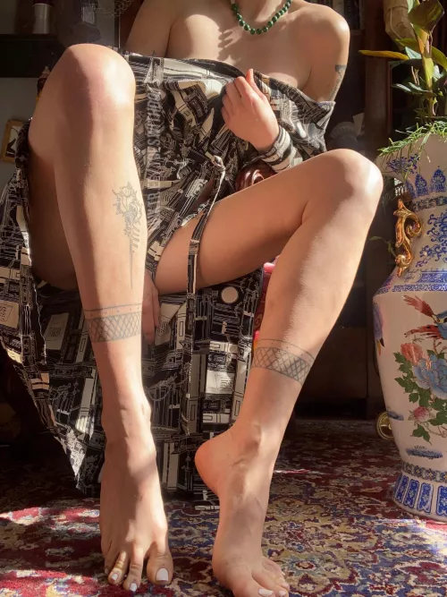 My long tattooed legs in the sun
