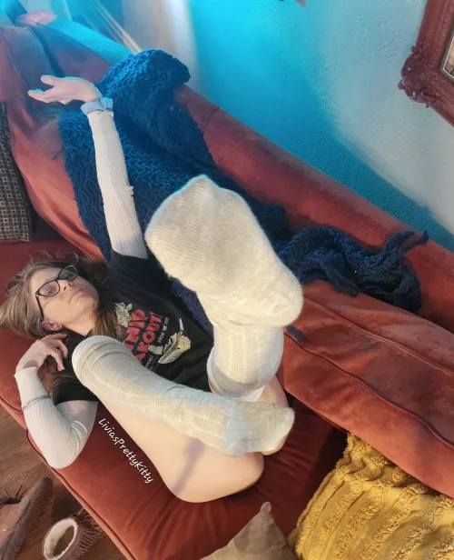 My socked feet up in the air ready for your face😘