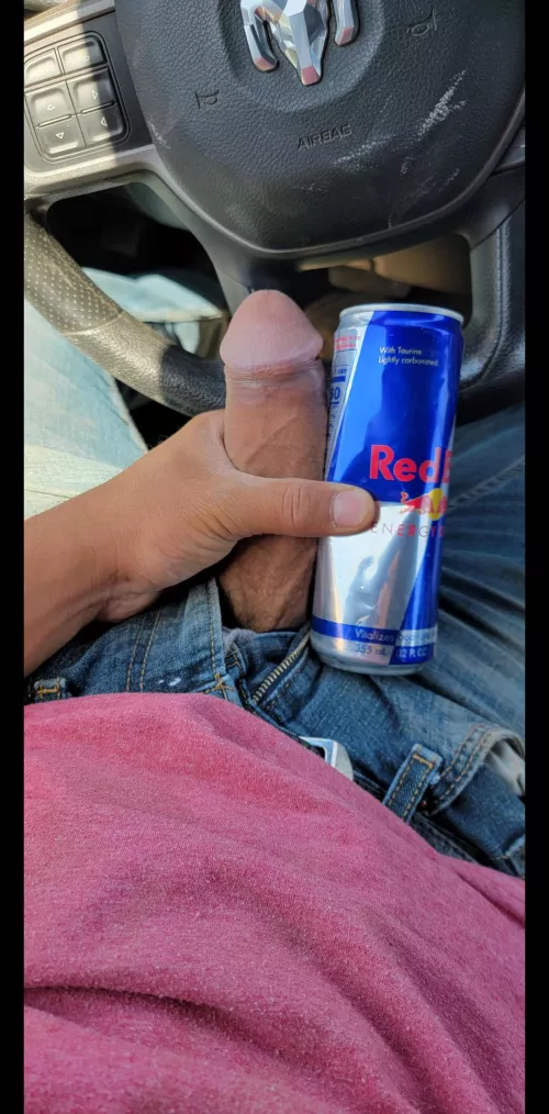 next to a red bull can and at work lol