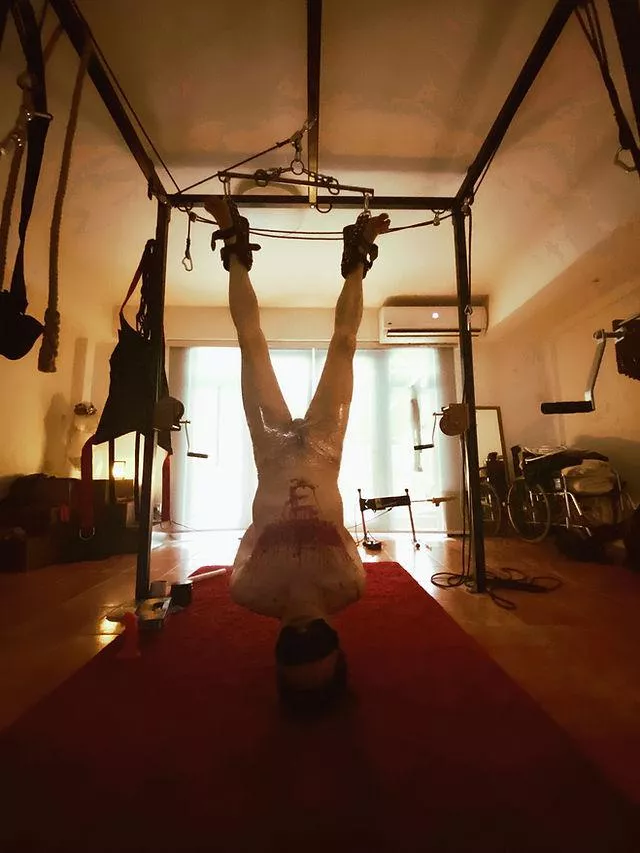 sensually enjoys her cigarette in front of him, teasing him slowly with the smoke, playing with it between her shiny lips, blowing it in his face, and dropping her ashes in his greedy mouth.