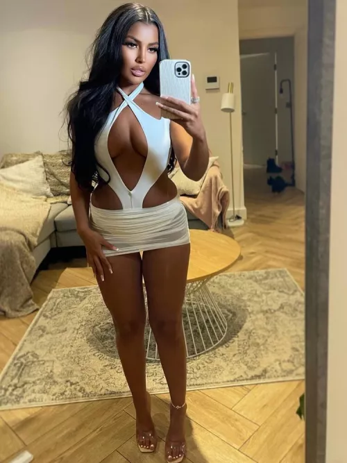 She's taking a picture for validation cause she knows all her holes are gonna be filled later that evening.