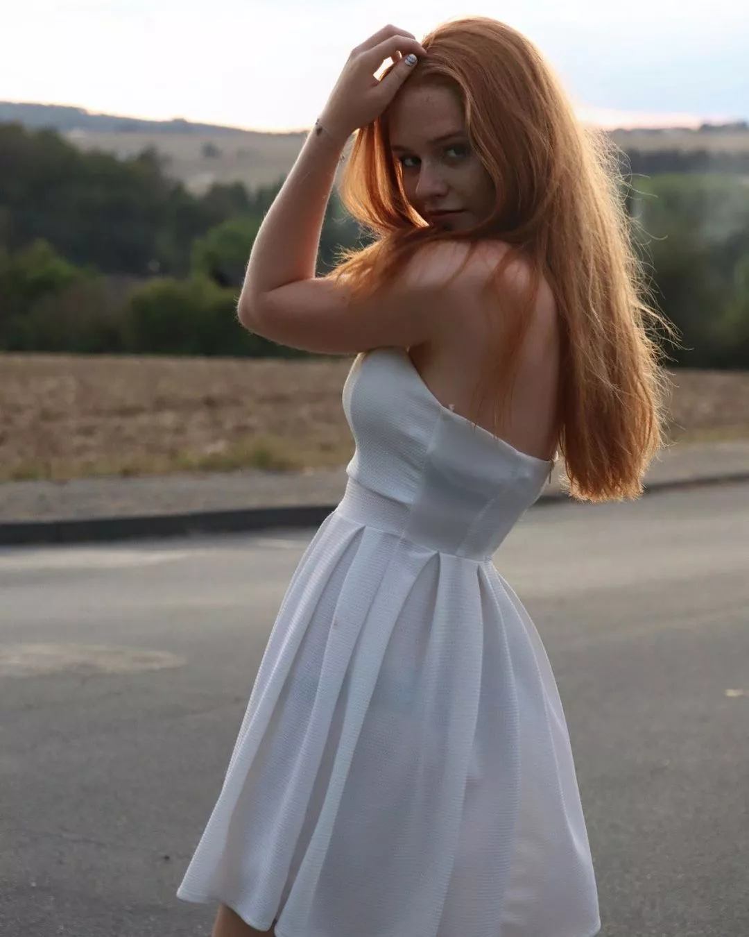 Slender beauty in sheer dress.