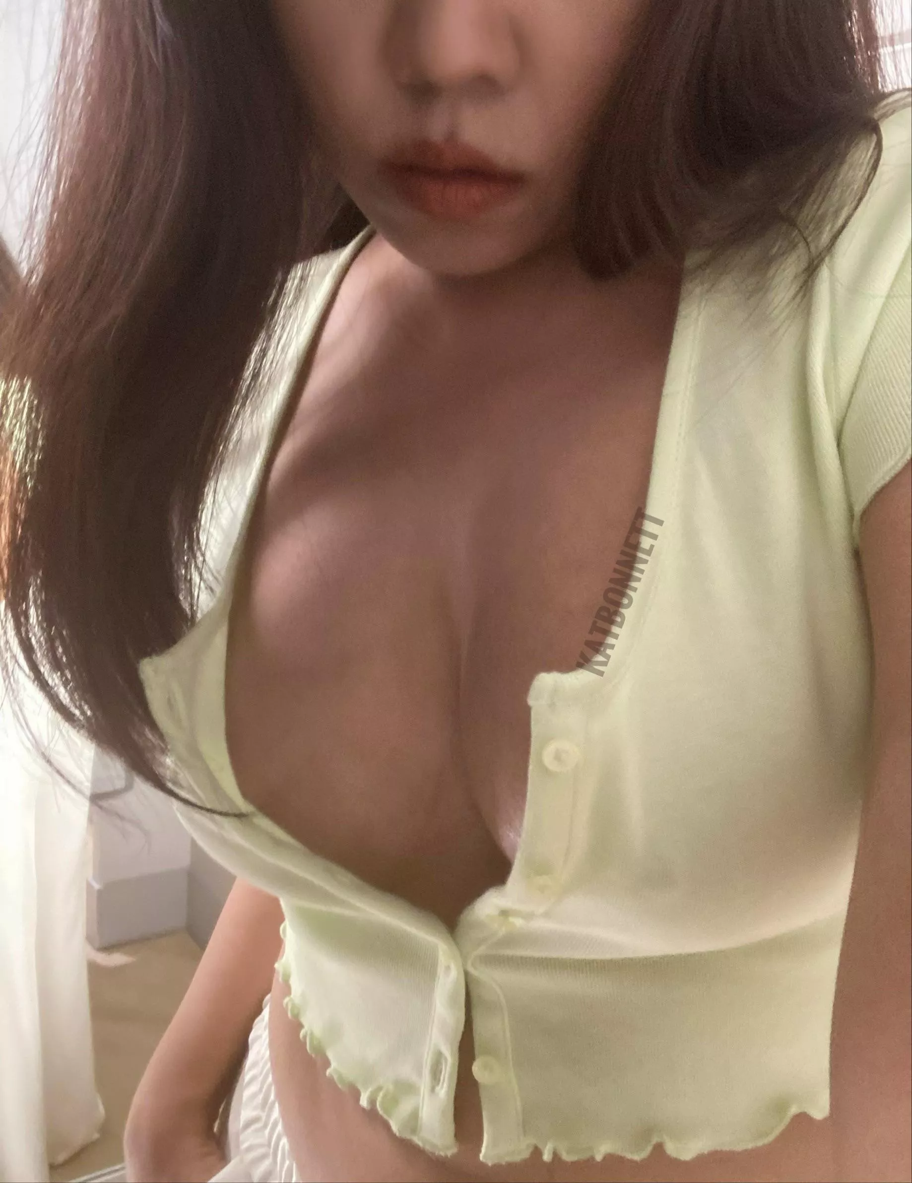 Titties are suffocating from this tight crop top.