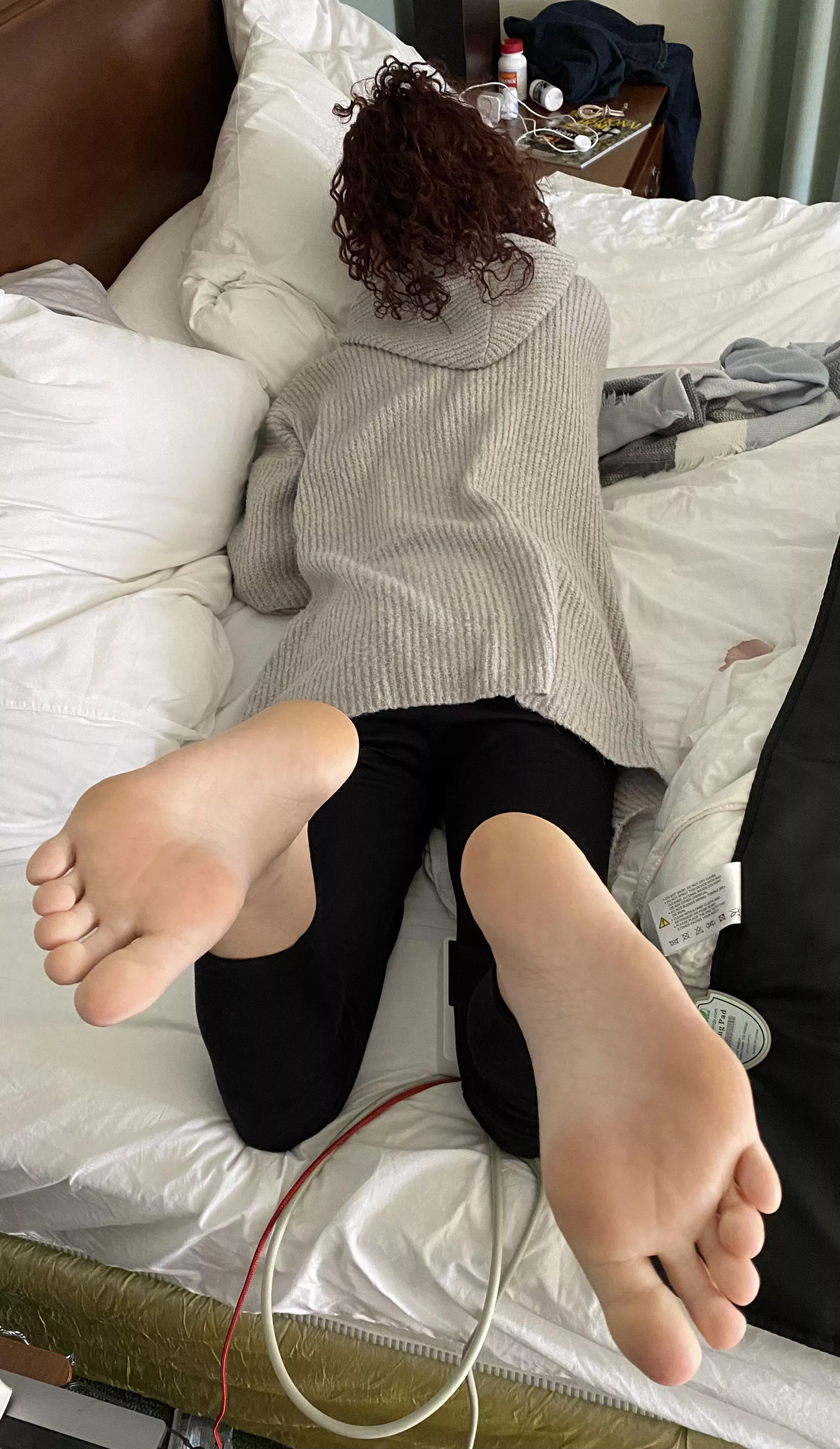 Wife on bed. Soles showing. Kind of a “reverse pose”