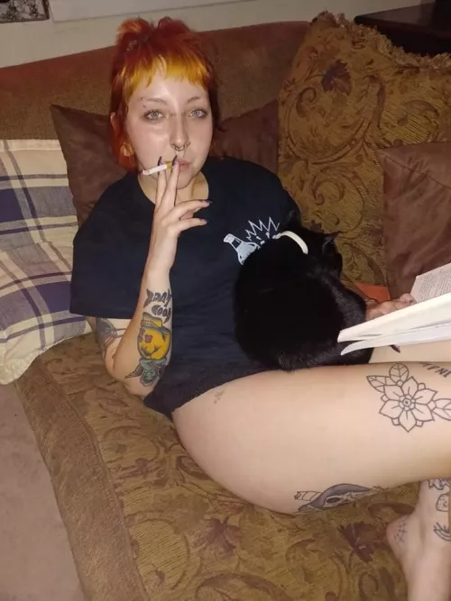 Having a cigarette on the couch with my book and cat! Any book recommendations?:) Having a cigarette on the couch with my book and cat! Any book recommendations?:)