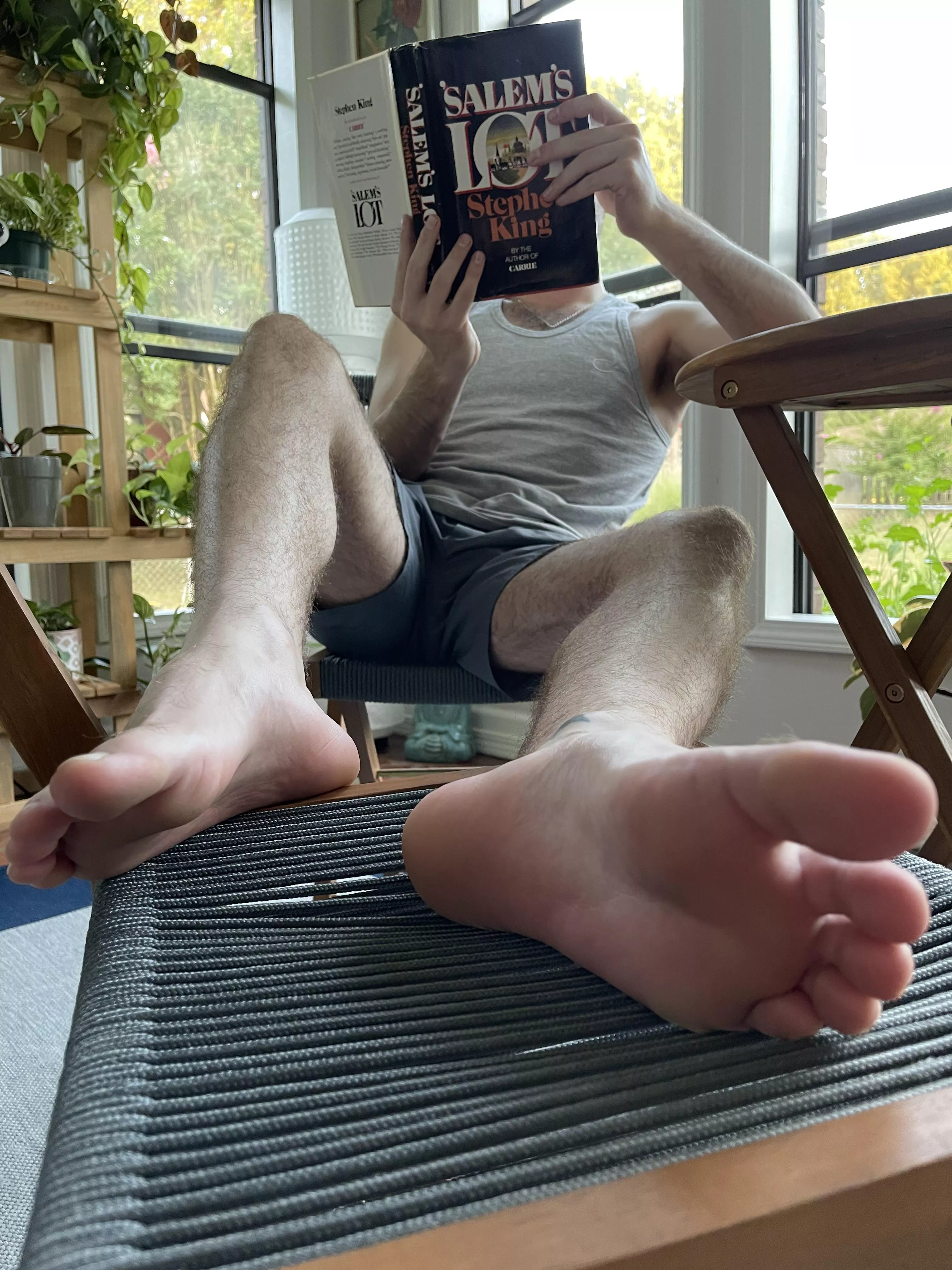 Taking in the finer things in life. Like you worshipping my feet. [22]