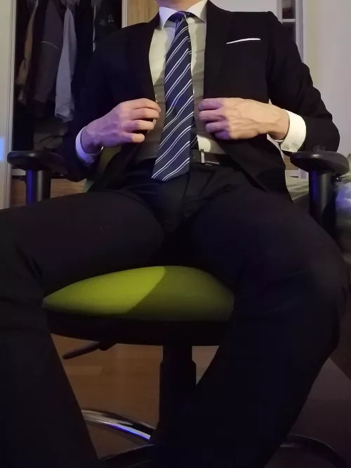 Sit on my thigh and rub my cock through my suit pants