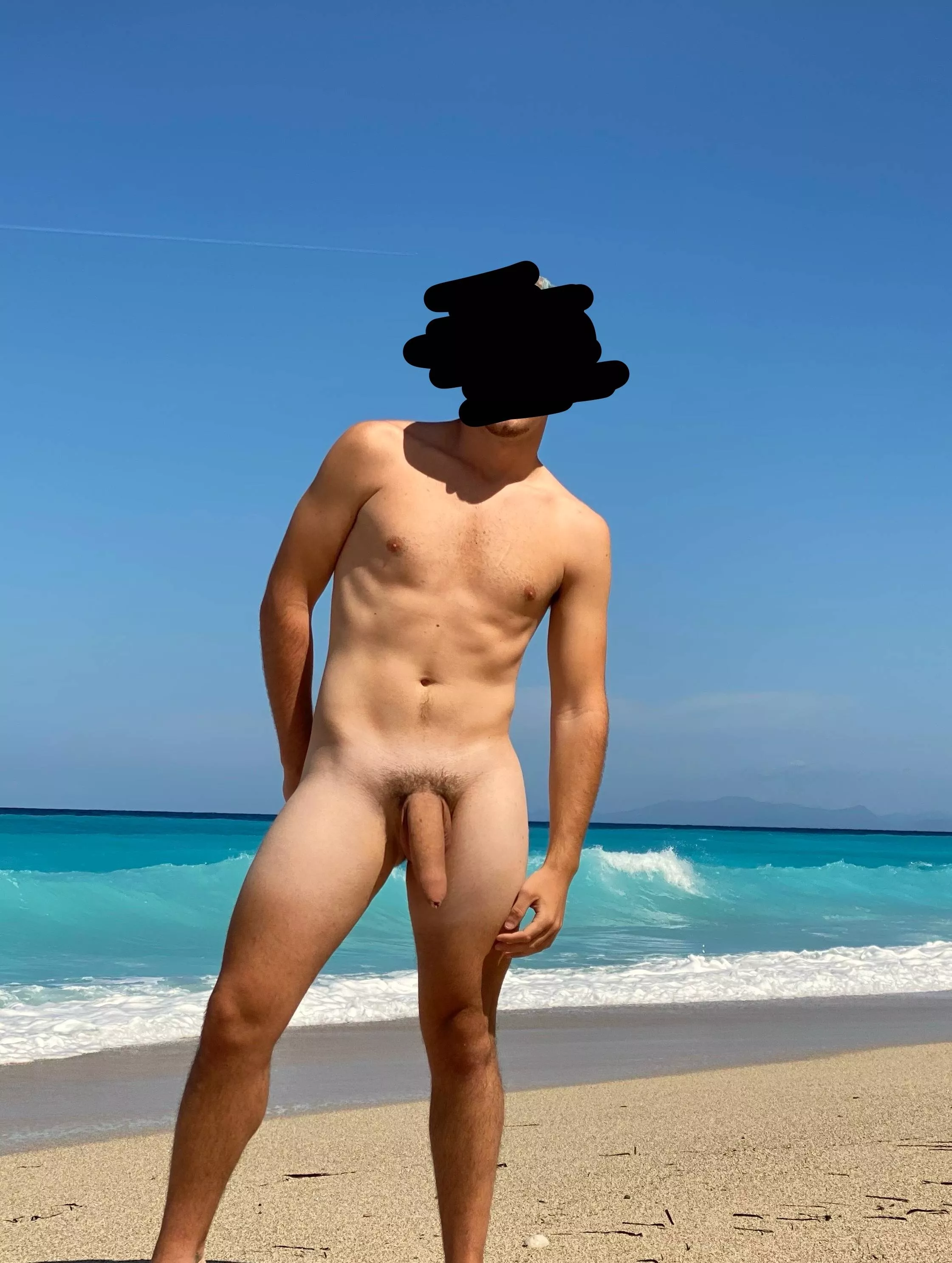flexing my semi-hard dick on a nudist beach 😜