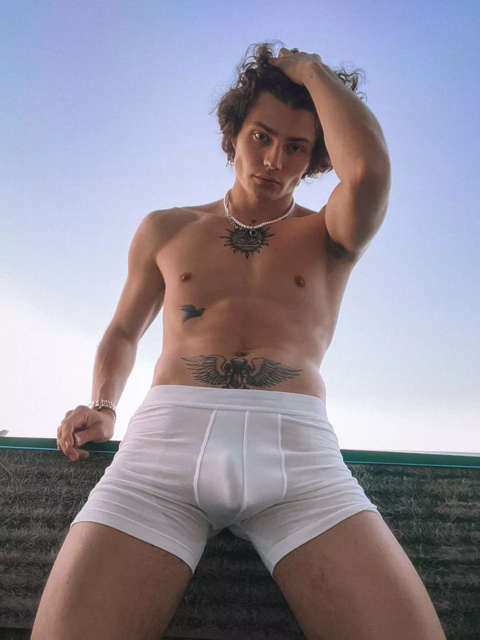 The warm, sea air develops my hair, I stand on the balcony and watch you pour wine into glasses