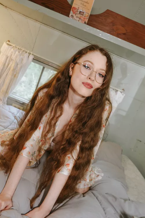 Chilling on the bed in my Vintage Airstream, just a Strawberry Robe and my Round Glasses!