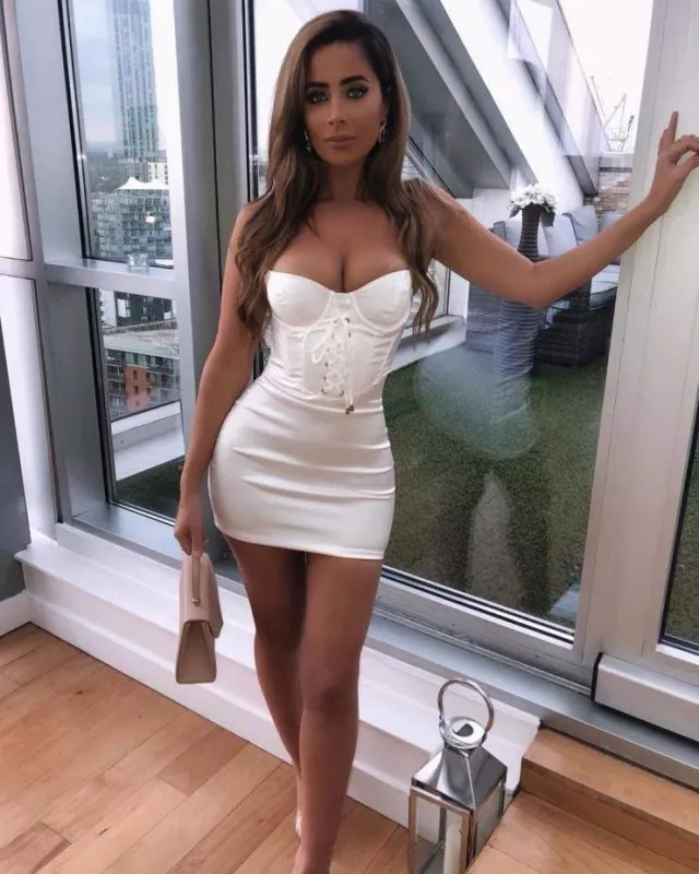 Looking irresistible in her corseted mini-dress 💖