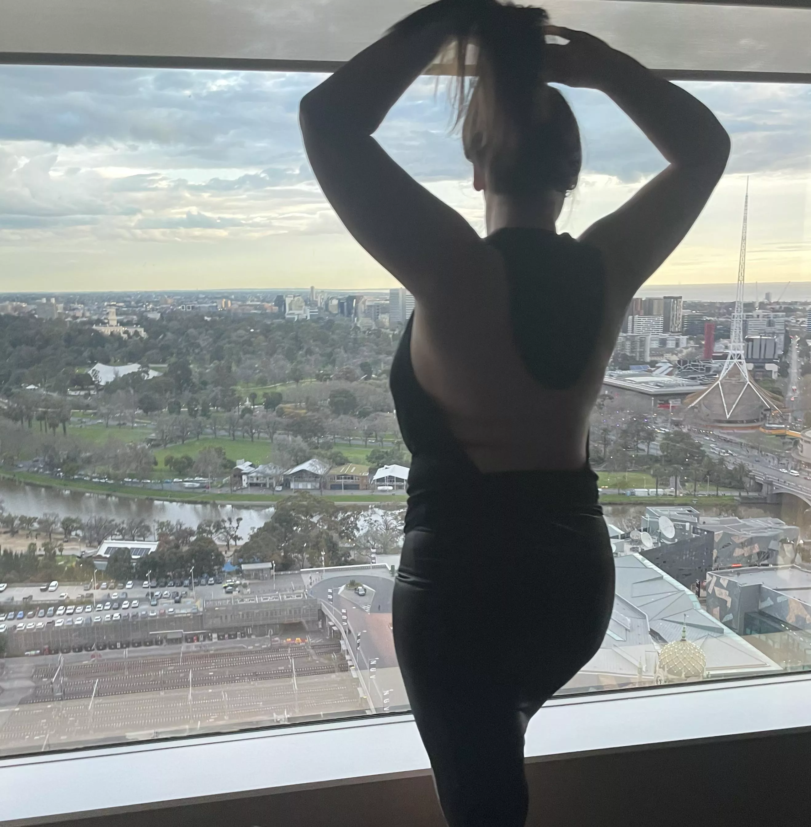 My 6 foot tall Amazonian hotwife [F] fixing her hair at our hotel room