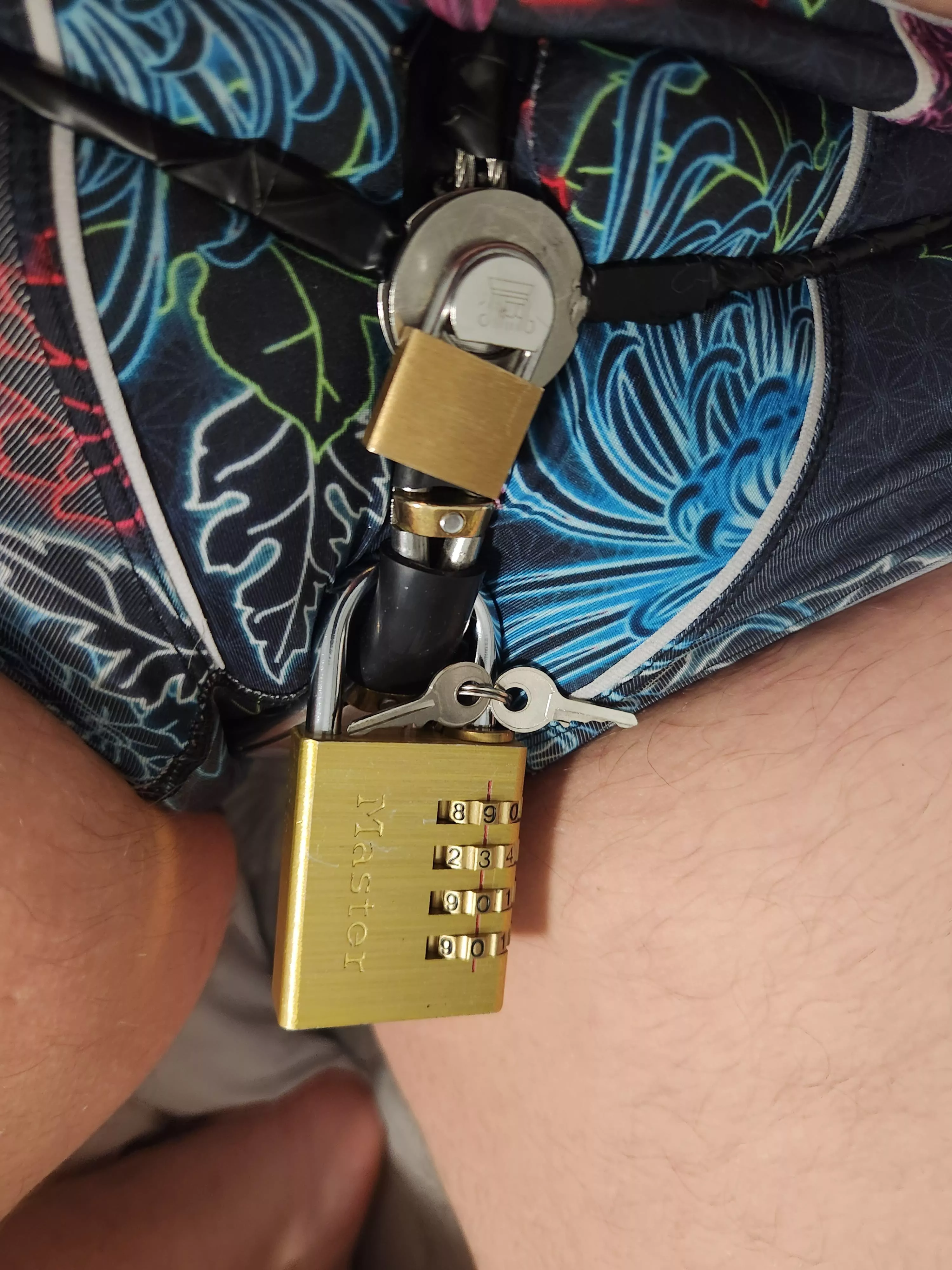 master loves to lock the keys to my belt, so close, yet so far. I can manoeuvre the keys to just brush the hole of the lock, but not enough to get it inside. ironic.