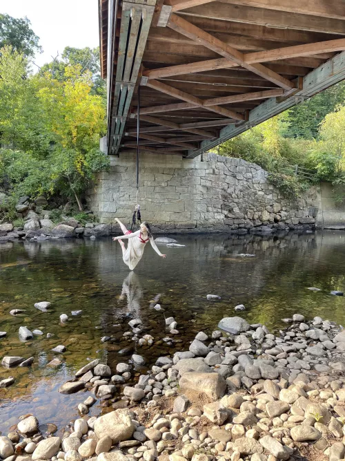 Suspended my beautiful bottom from a bridge over the river