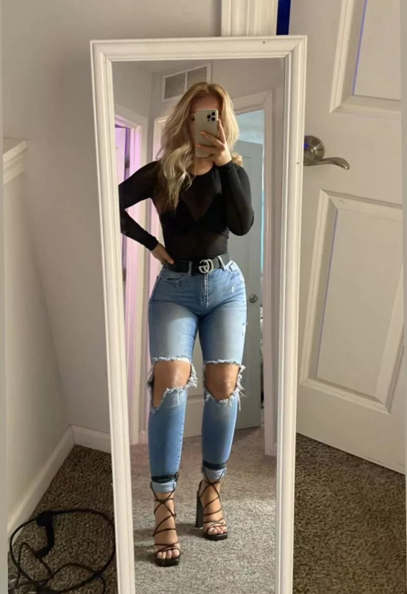 Sexy petite blonde in ripped jeans and heels