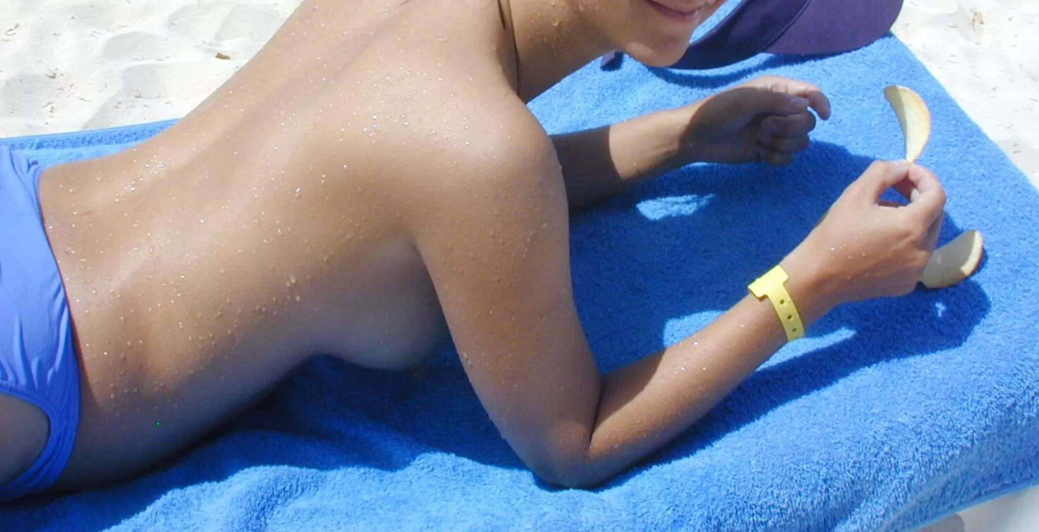 Propped on elbows at the beach - great side view.