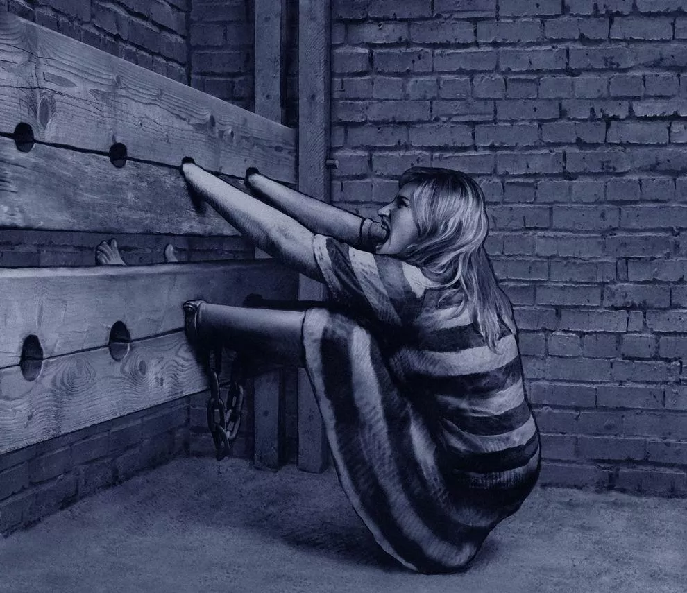 Locked in the stocks and still in ankle shackles