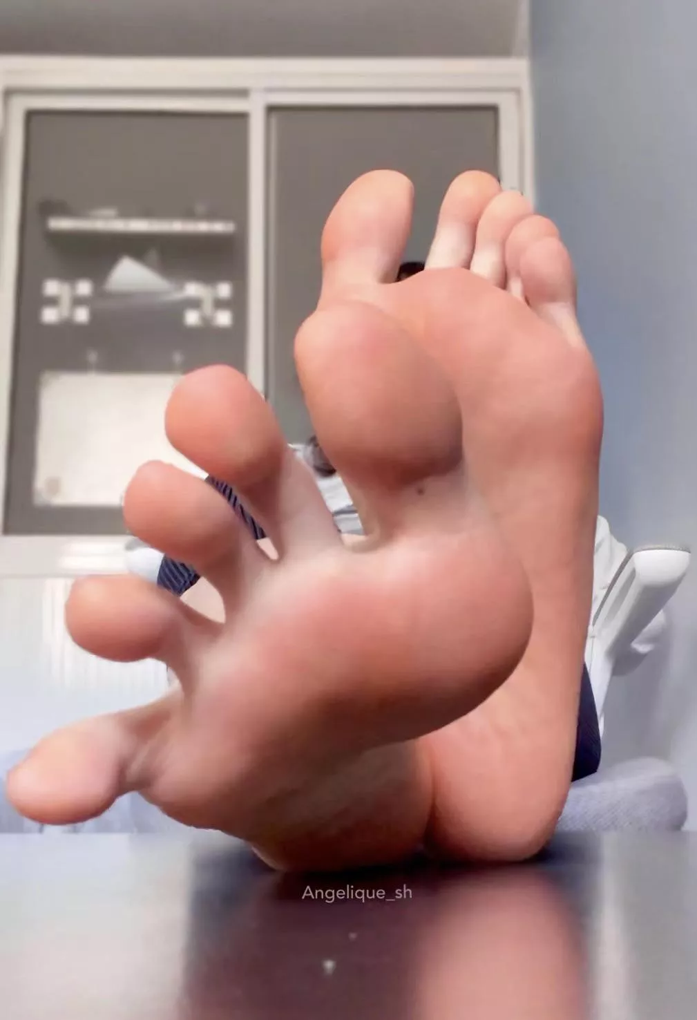 Spreading my toes wide in your face 😉