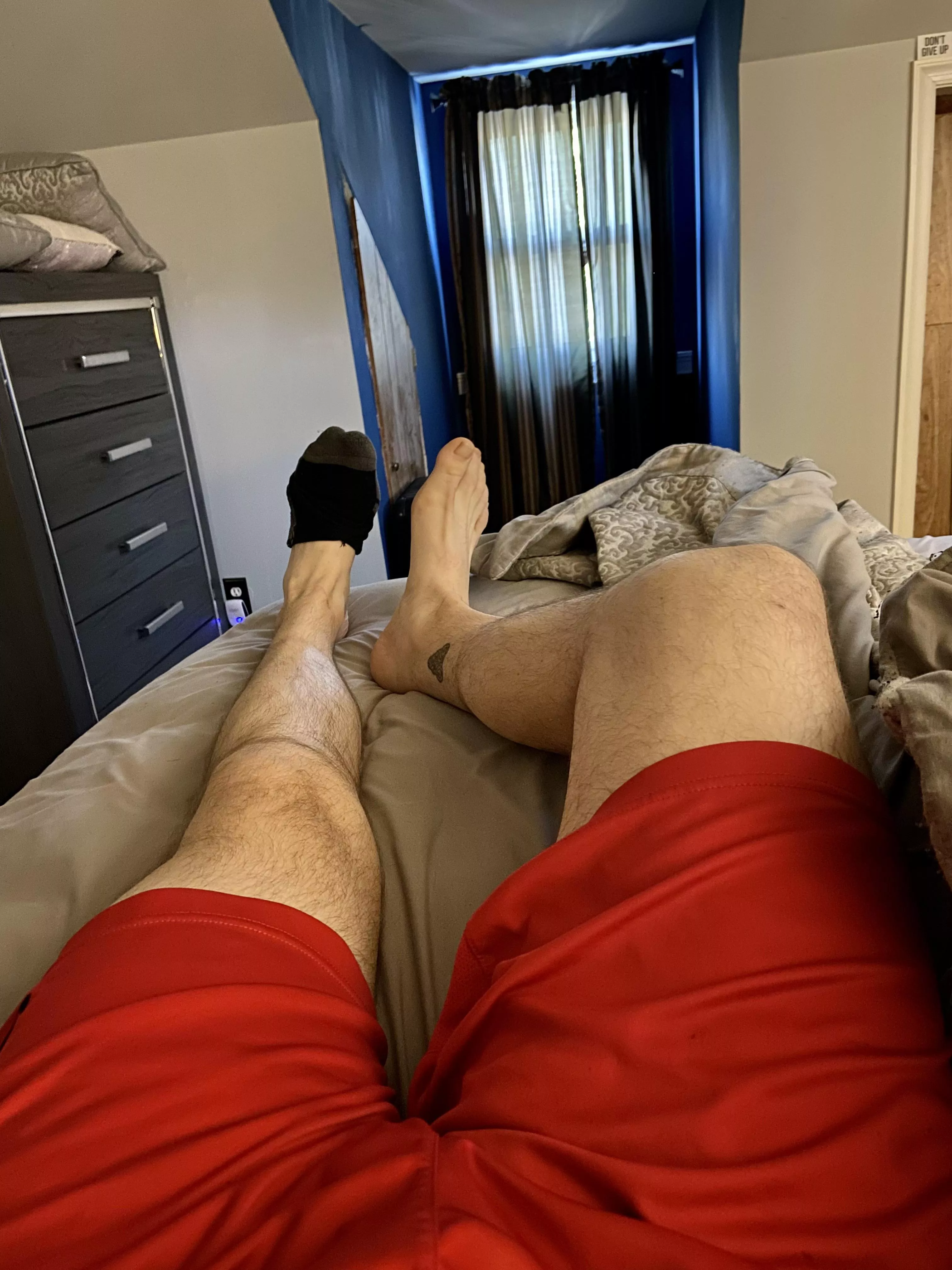 You should be at the edge of the bed taking care of these size 13 feet 😏