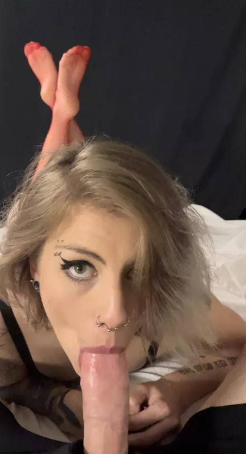 First still frame from video we just shot. Red fishnet legs crossed while she lays on the bed and swallows my load.