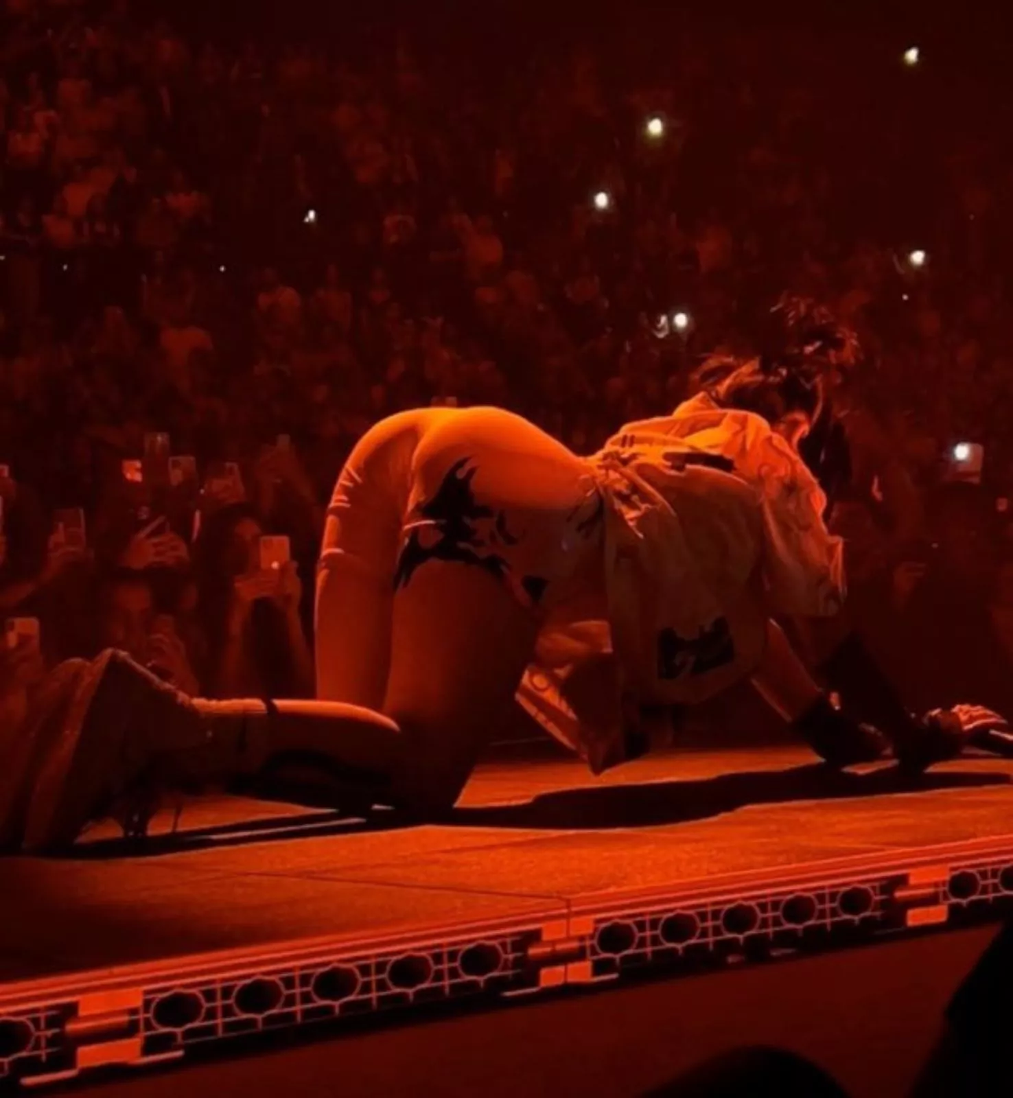 Billie Eilish is suspiciously skilled at arching her back and showing off that big ass of hers