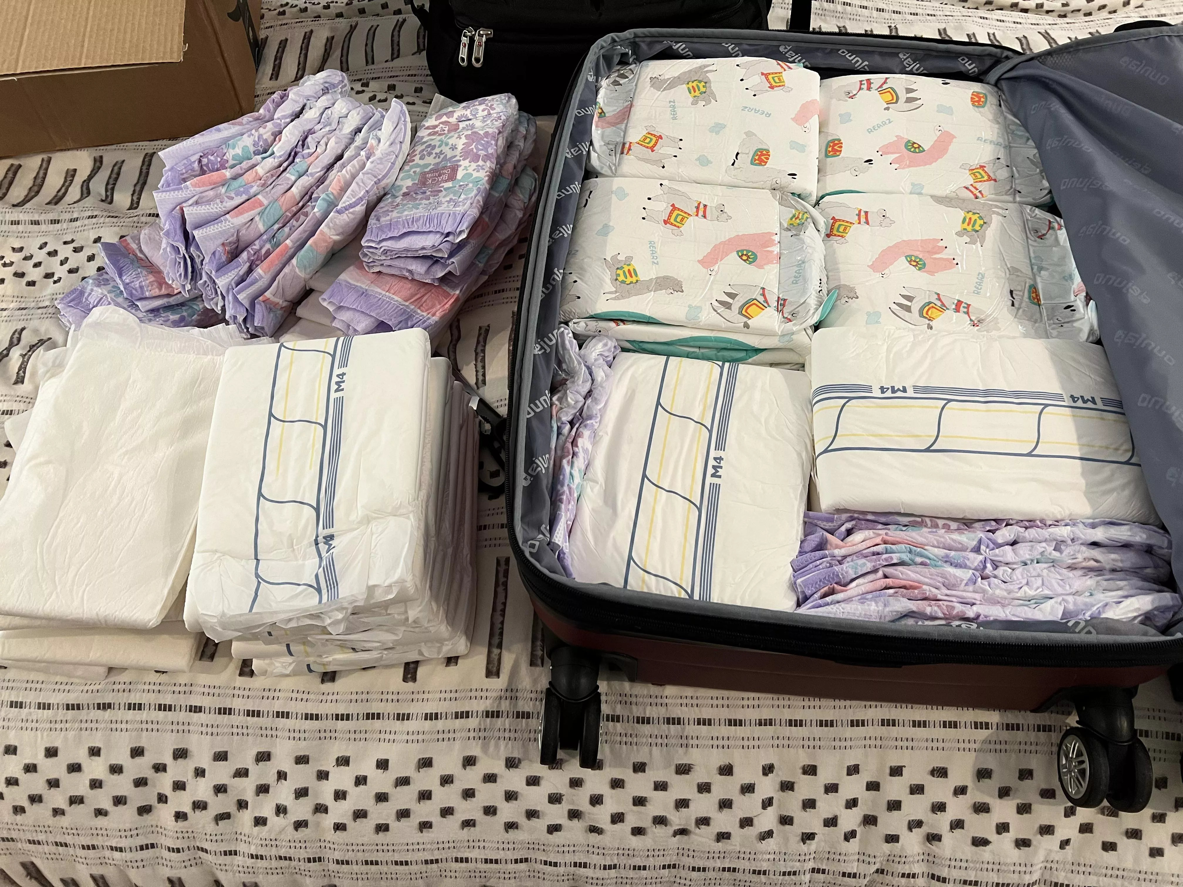 Ready for my trip. I made them fit loooool. More diapers then clothes…..is that a bad thing????
