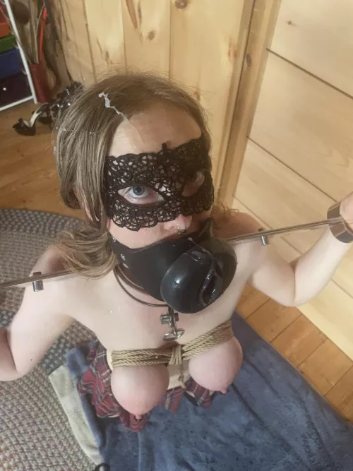 A thoroughly used mouthpussy locked in metal stocks