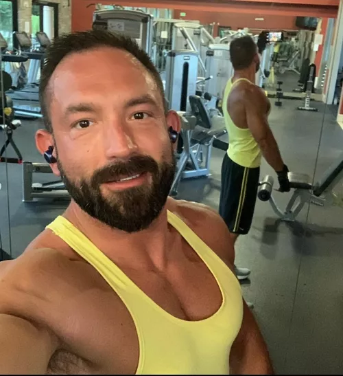 In the gym in my yellow tank on hump day. Have a good one!
