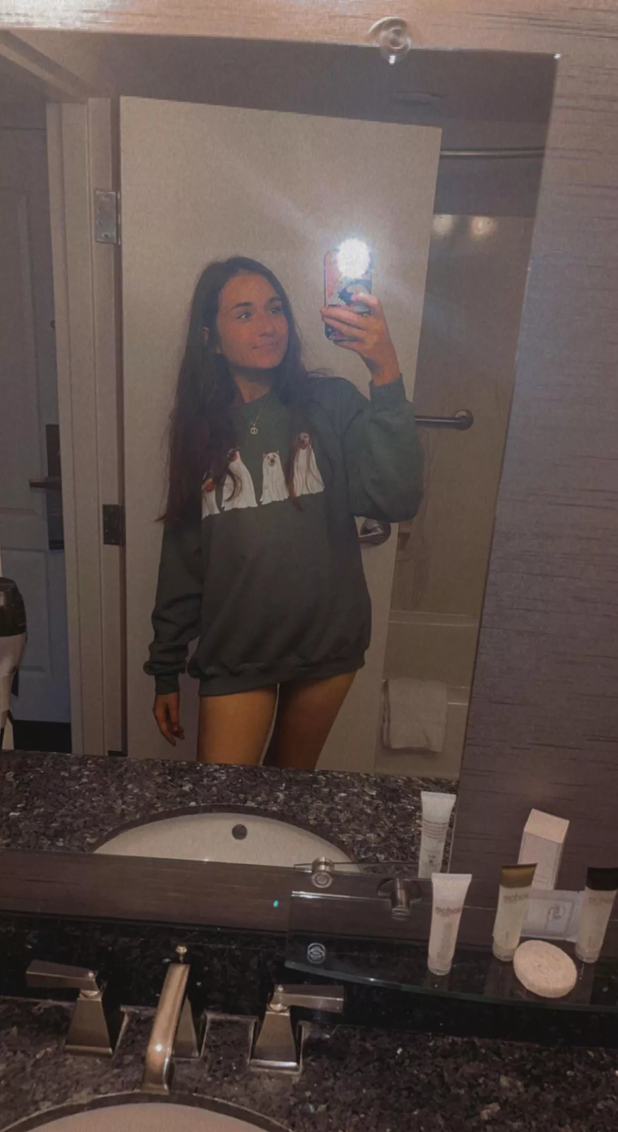 Showing off the cute doggos on my sweater!!