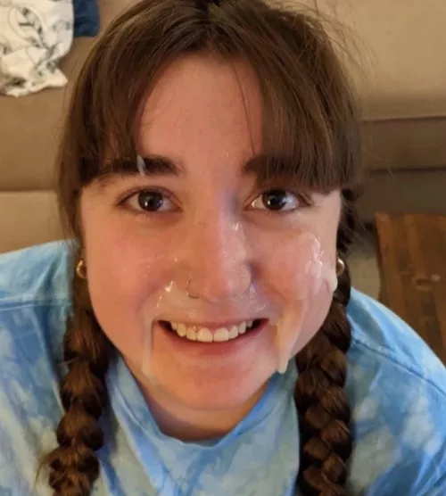 Face full of cum and smiling