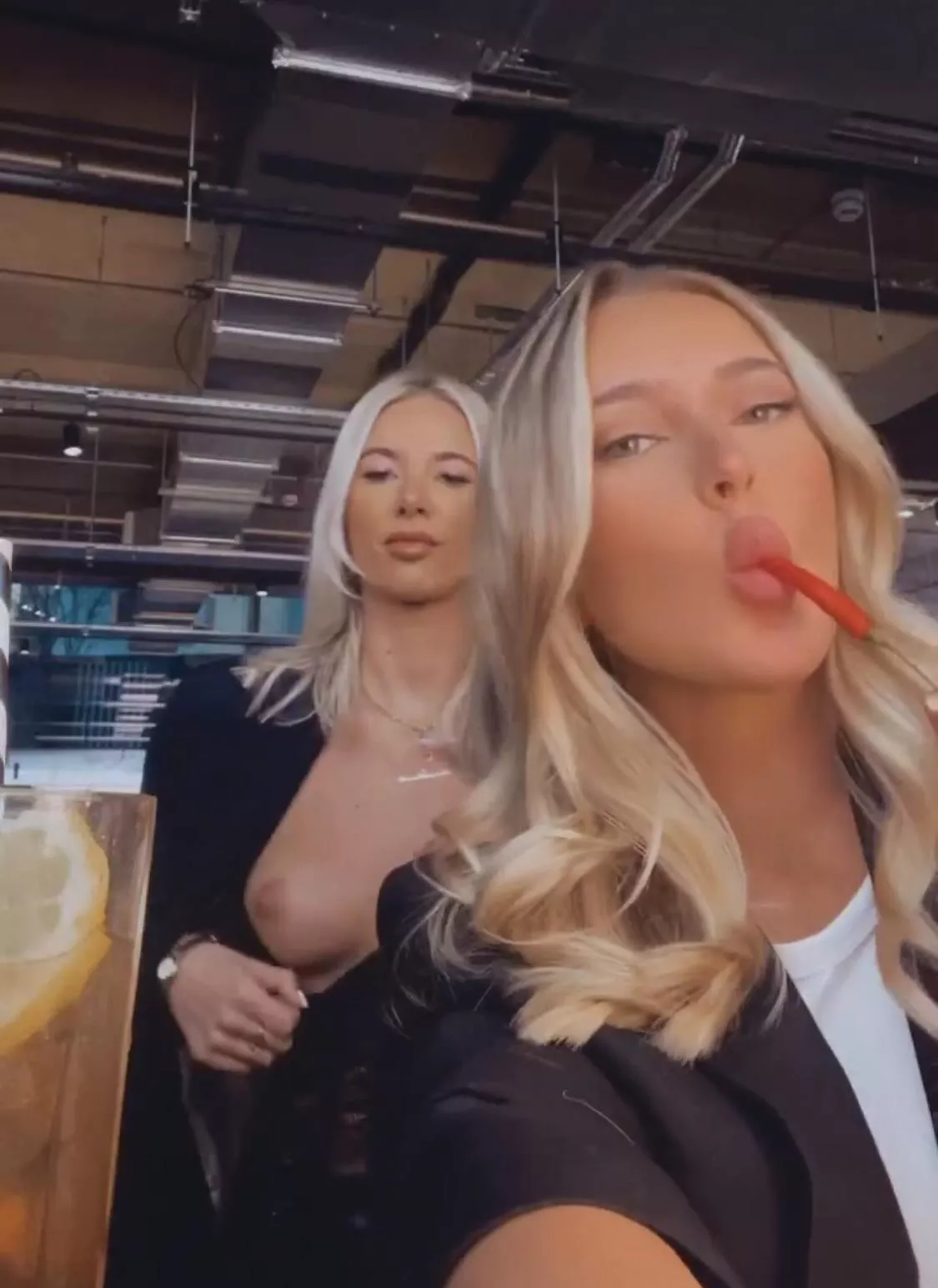 Little blonde slut showing her tit.