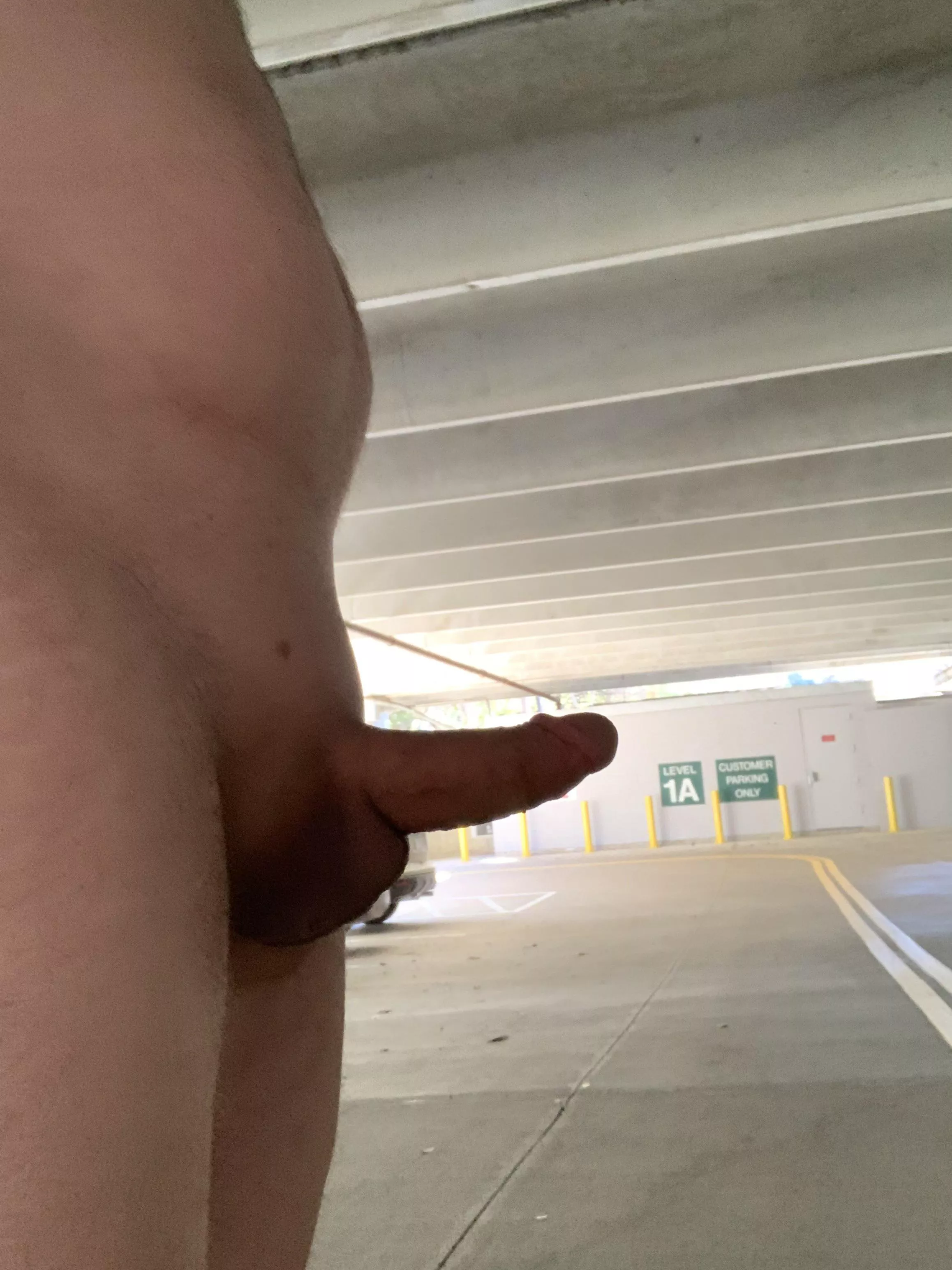 Naked stroll in a parking garage