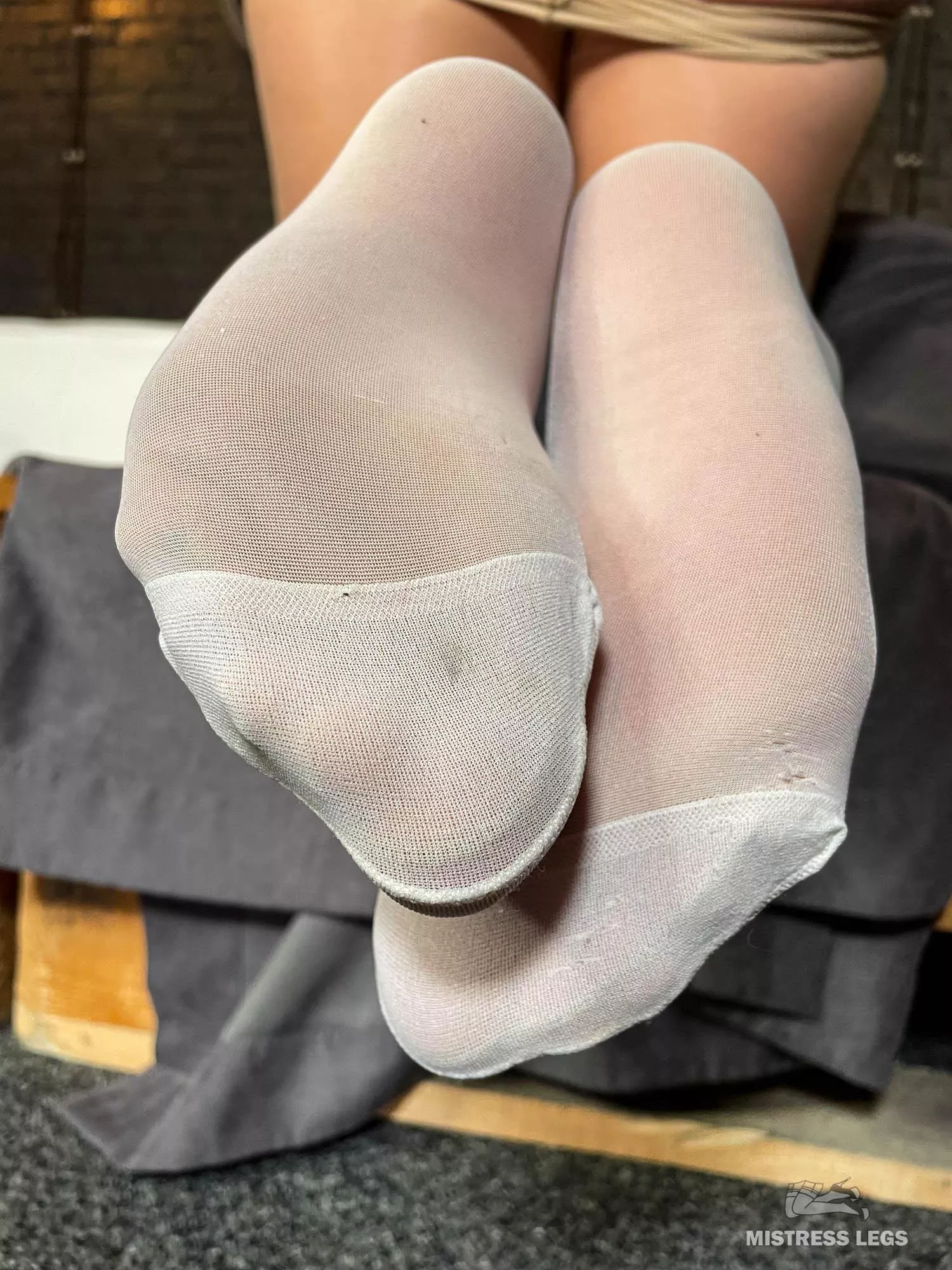 White stockings over flesh-colored pantyhose