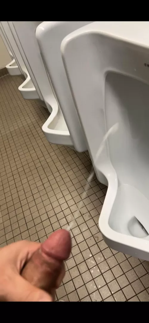 Waiting for someone to come around the corner in this college bathroom