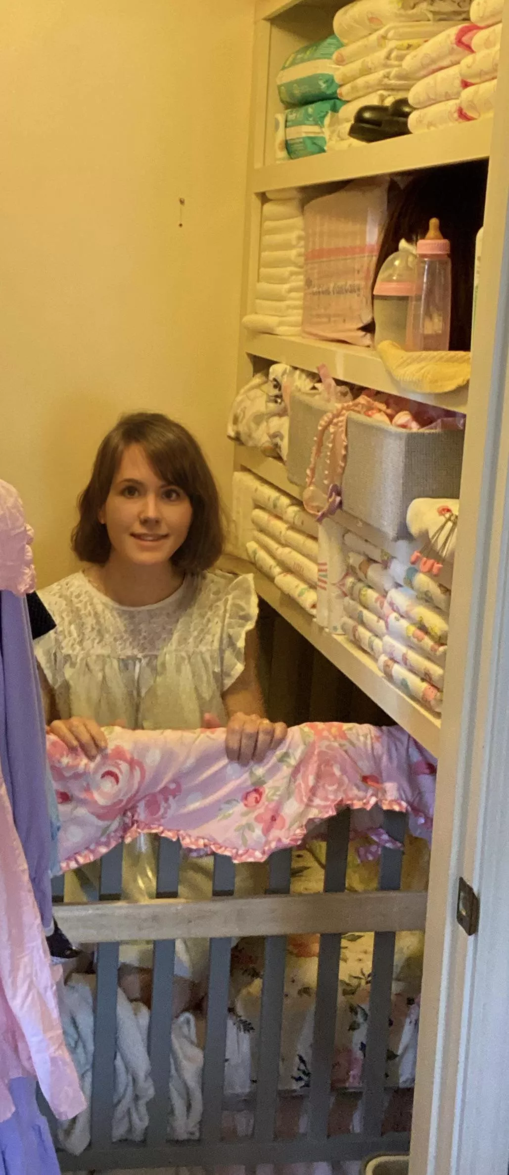 Here’s my little in her crib and “closet nursery.” We use facial editing to protect her ID. But this pic came out so different! It hardly looks like her! Still super cuteee!!