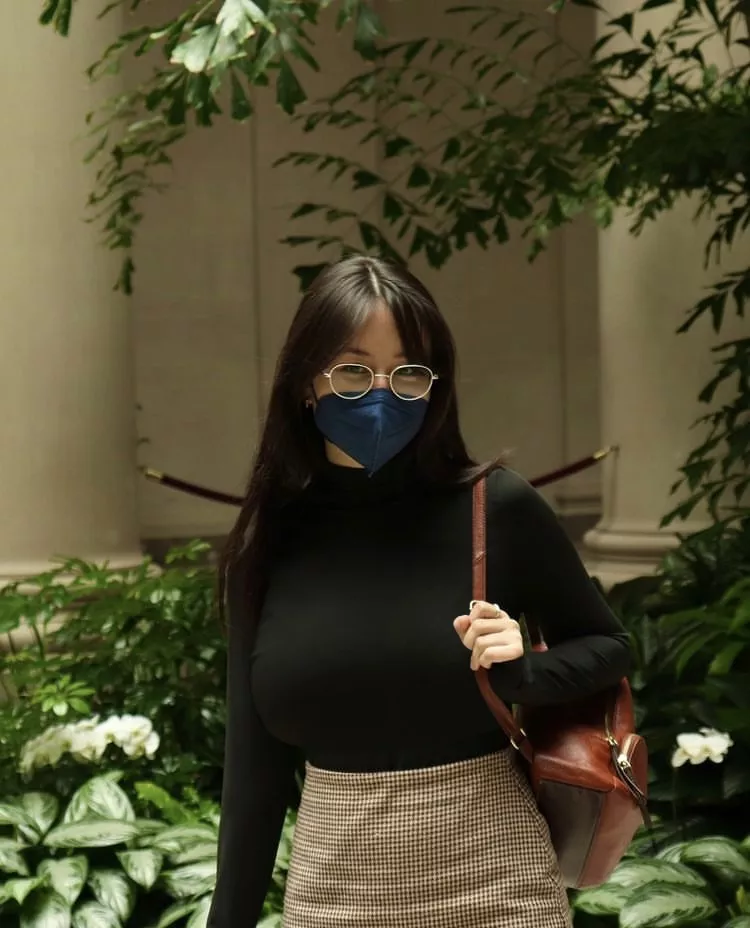 black sweater and blue mask