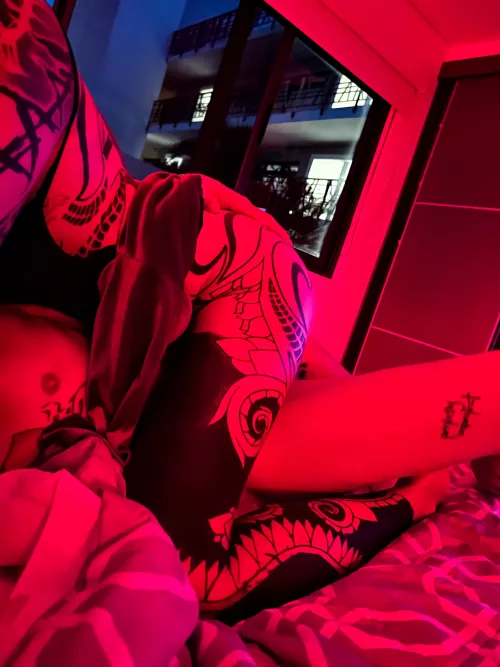 Red riding hood, when the art on your body looks epic with red light