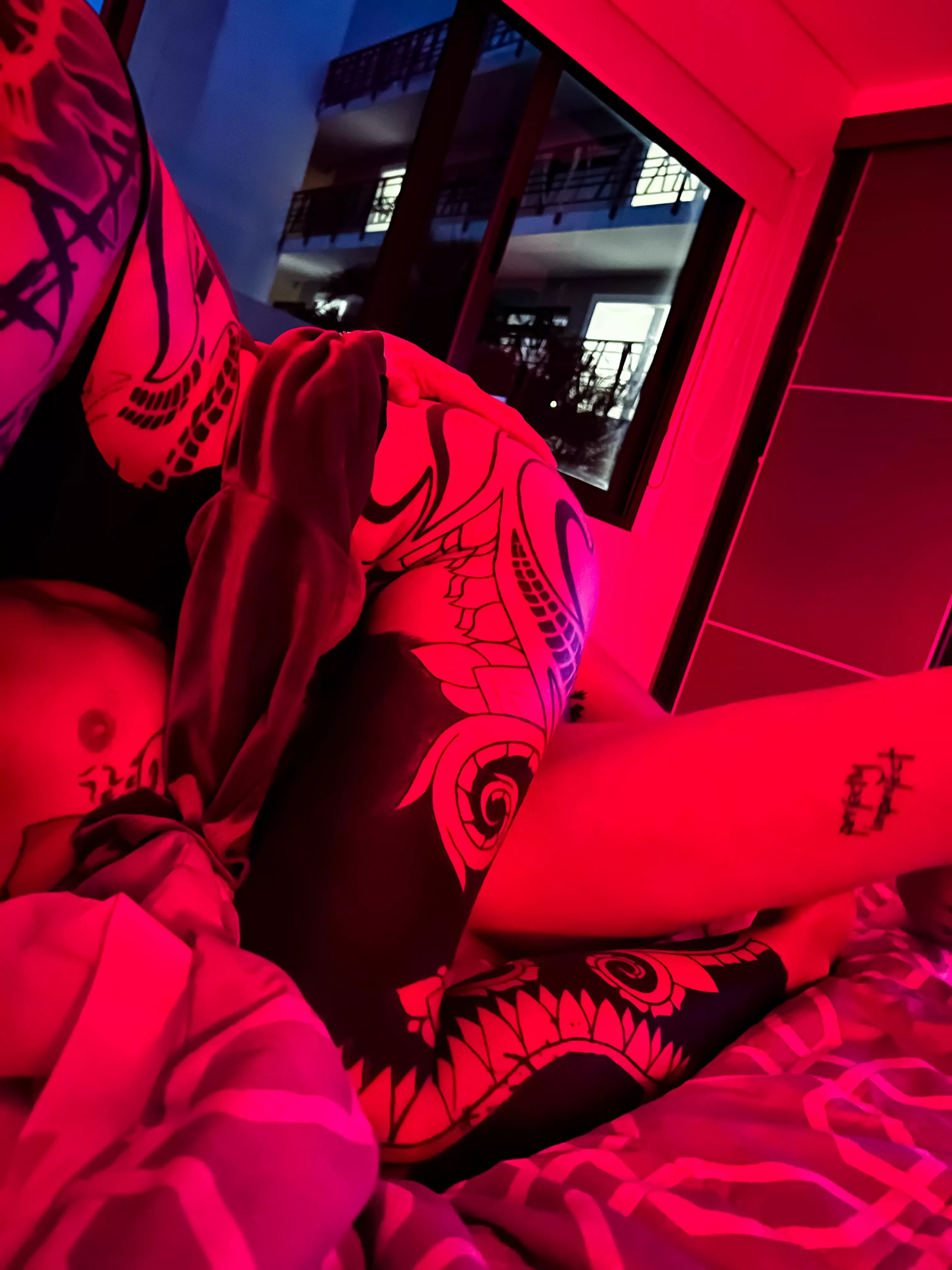 Red riding hood, when the art on your body looks epic with red light