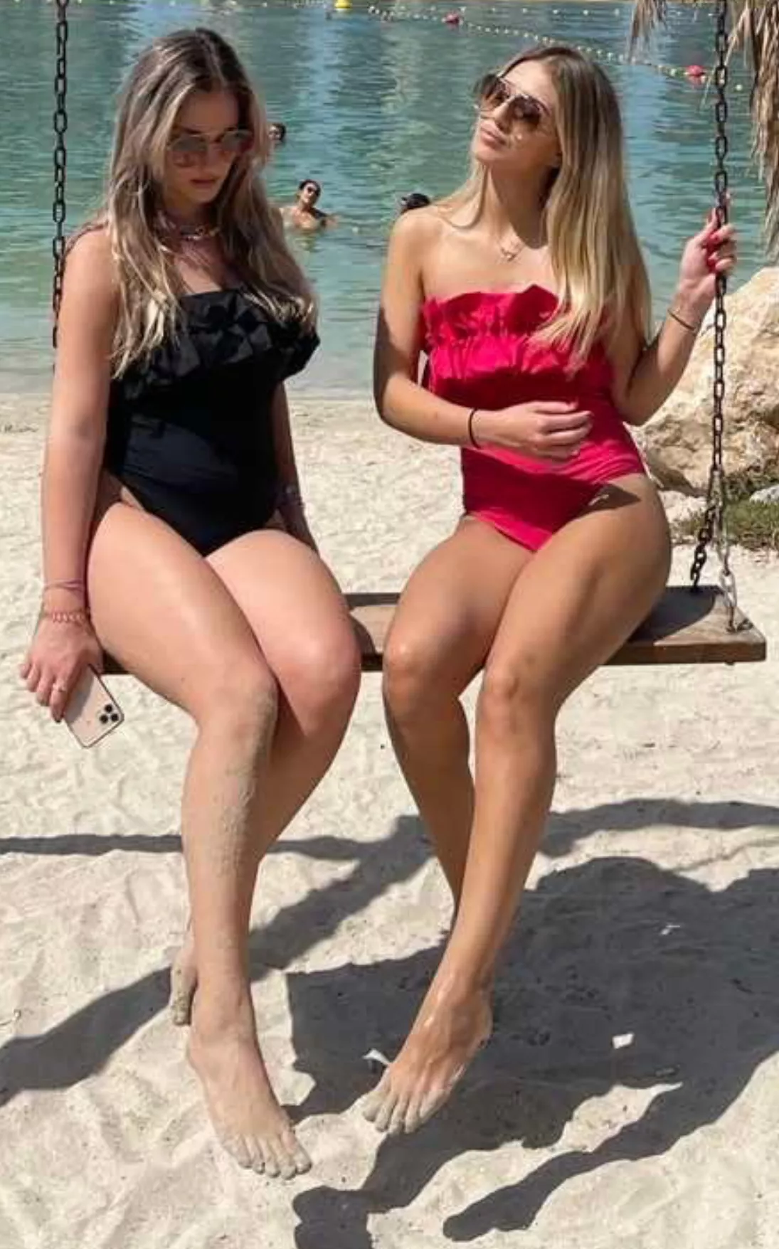 Girl with black swimsuit or red swimsuit ?