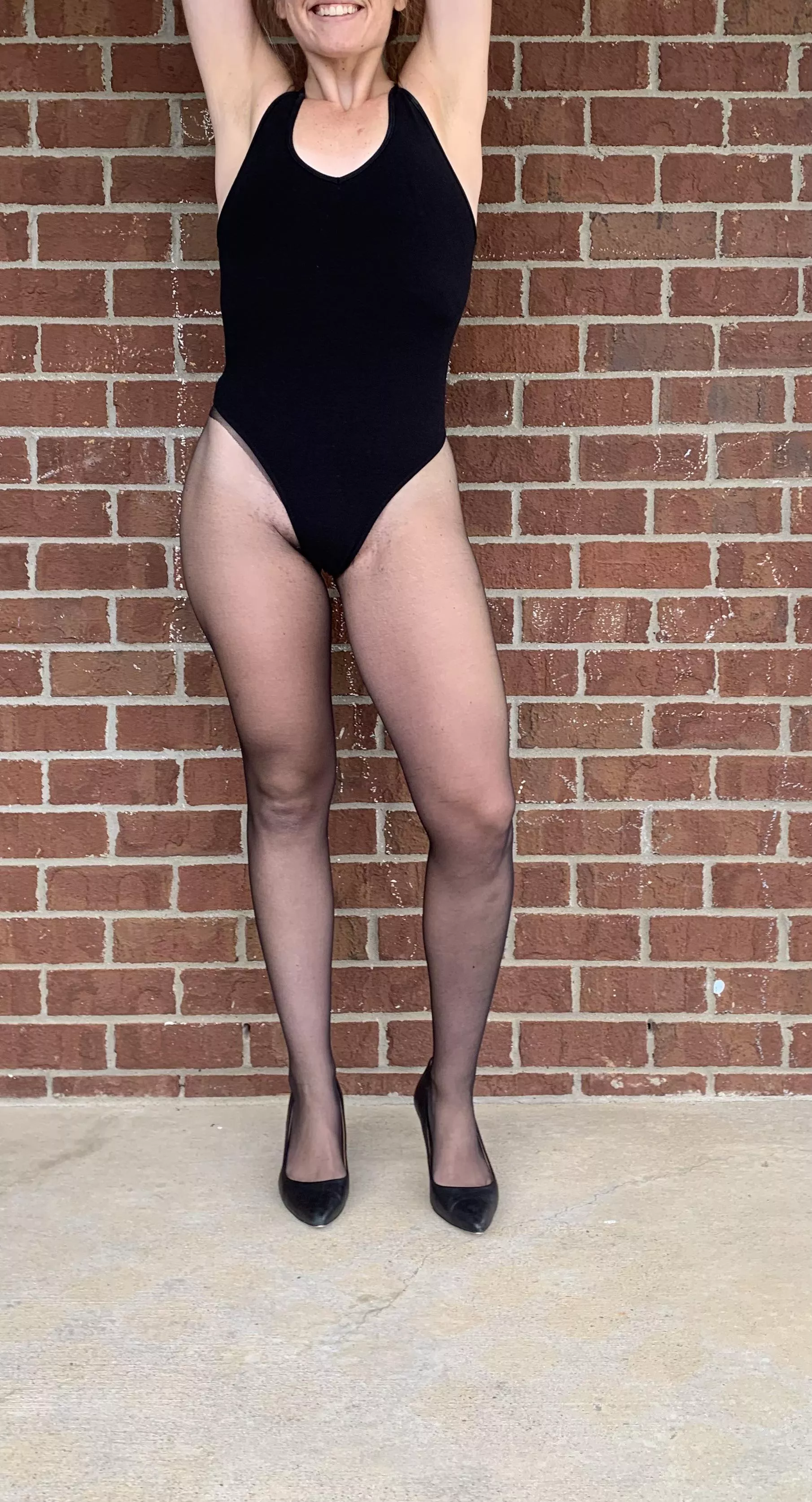 Wi[f]e in black pantyhose and leotard