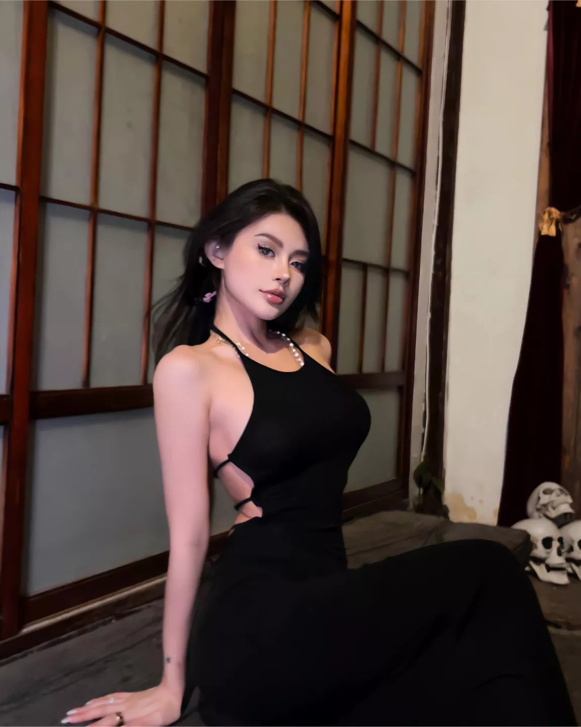 Black dress and pearl necklace