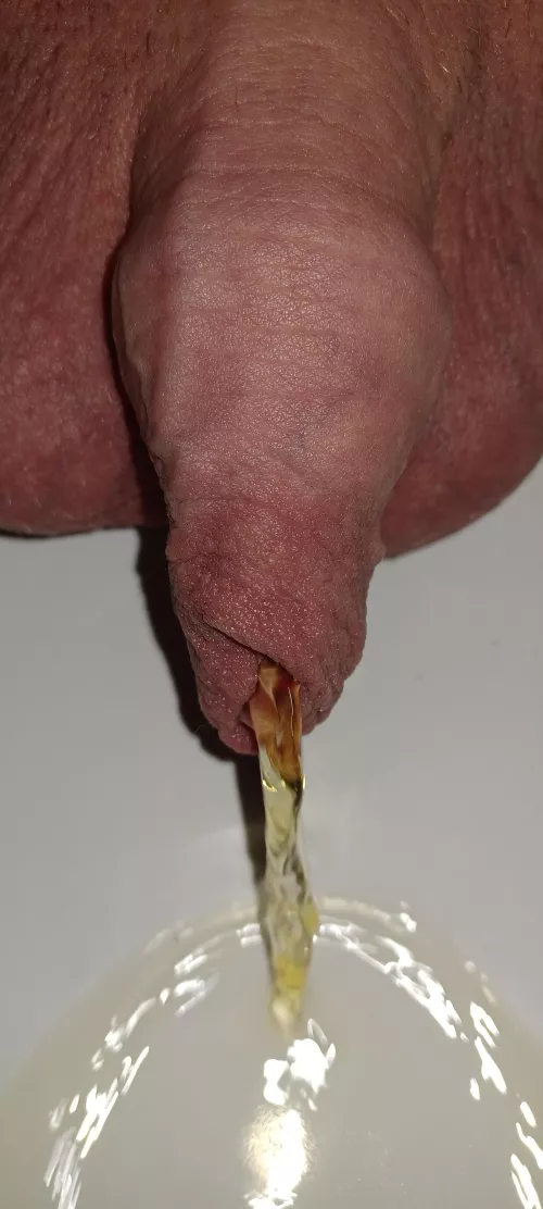 a middle aged man pissing