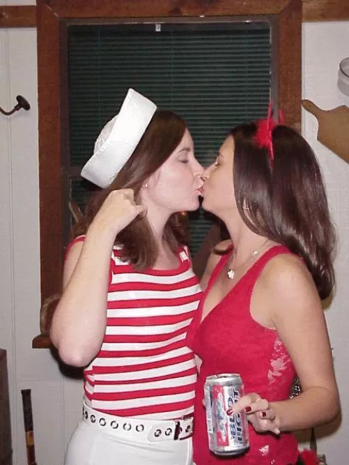 A sailor and a lil devil kiss