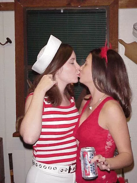A sailor and a lil devil kiss