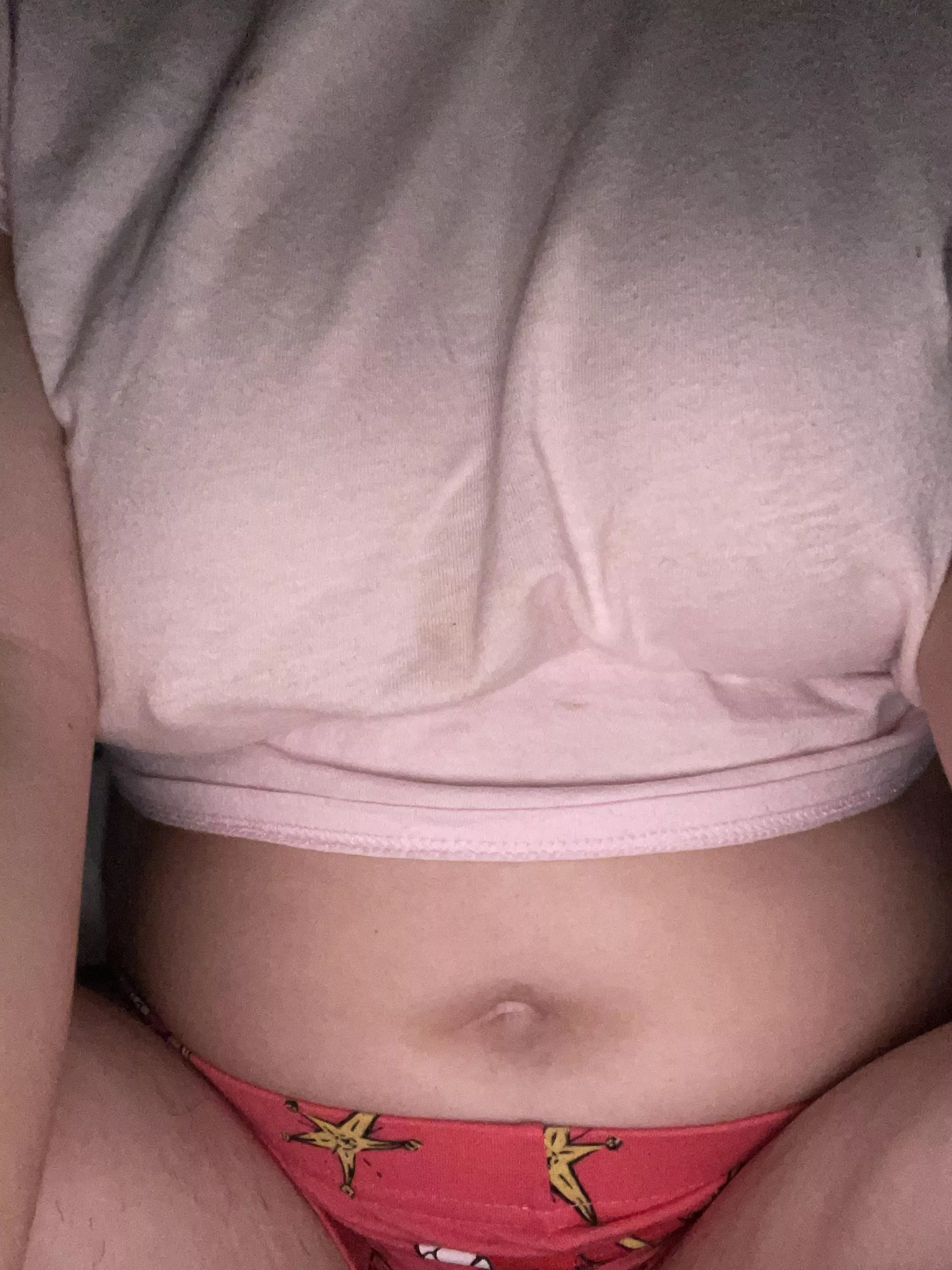 Braless and belly button out who wants to play with it ?