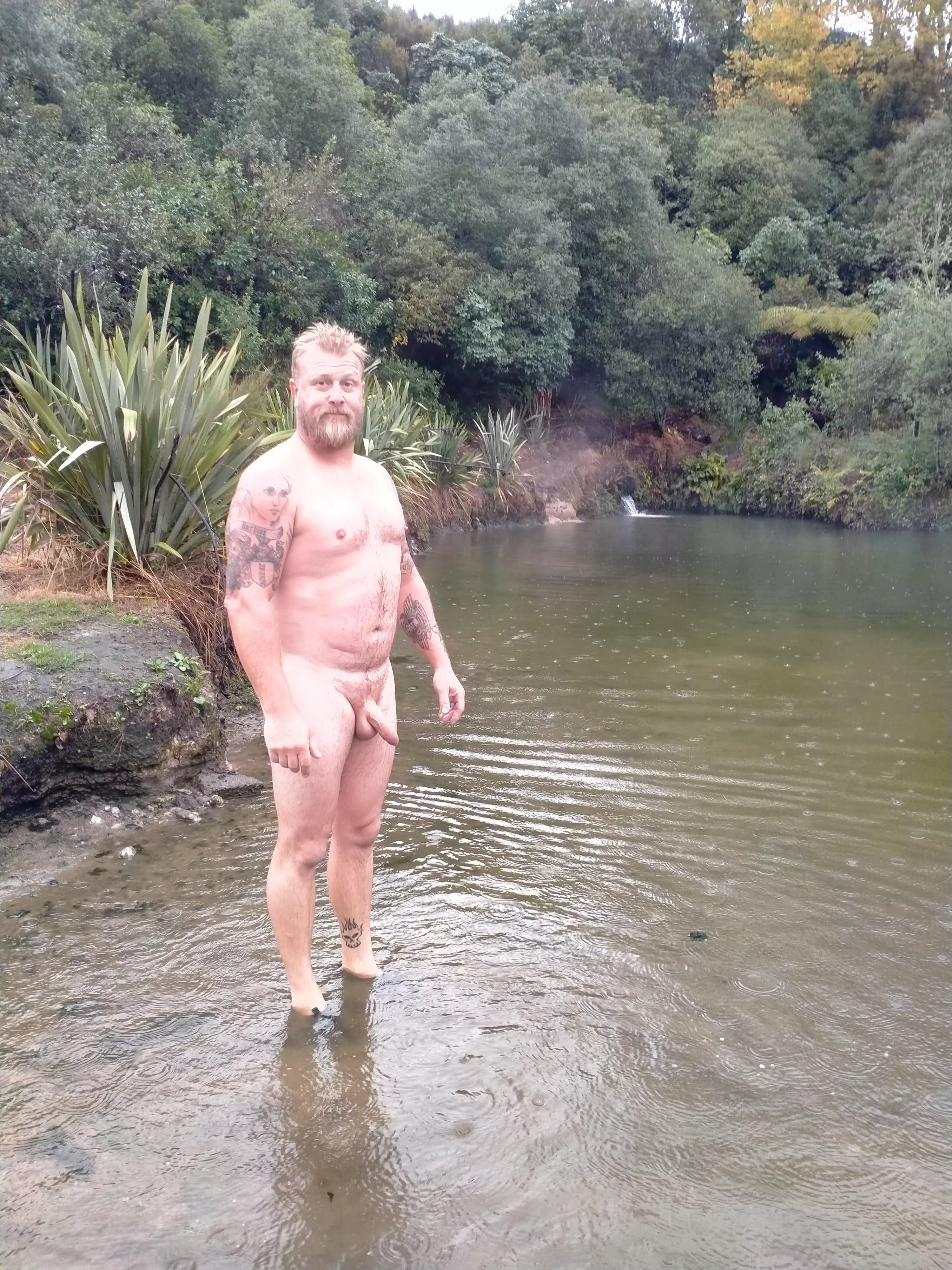 in the rain at a natural thermal pool